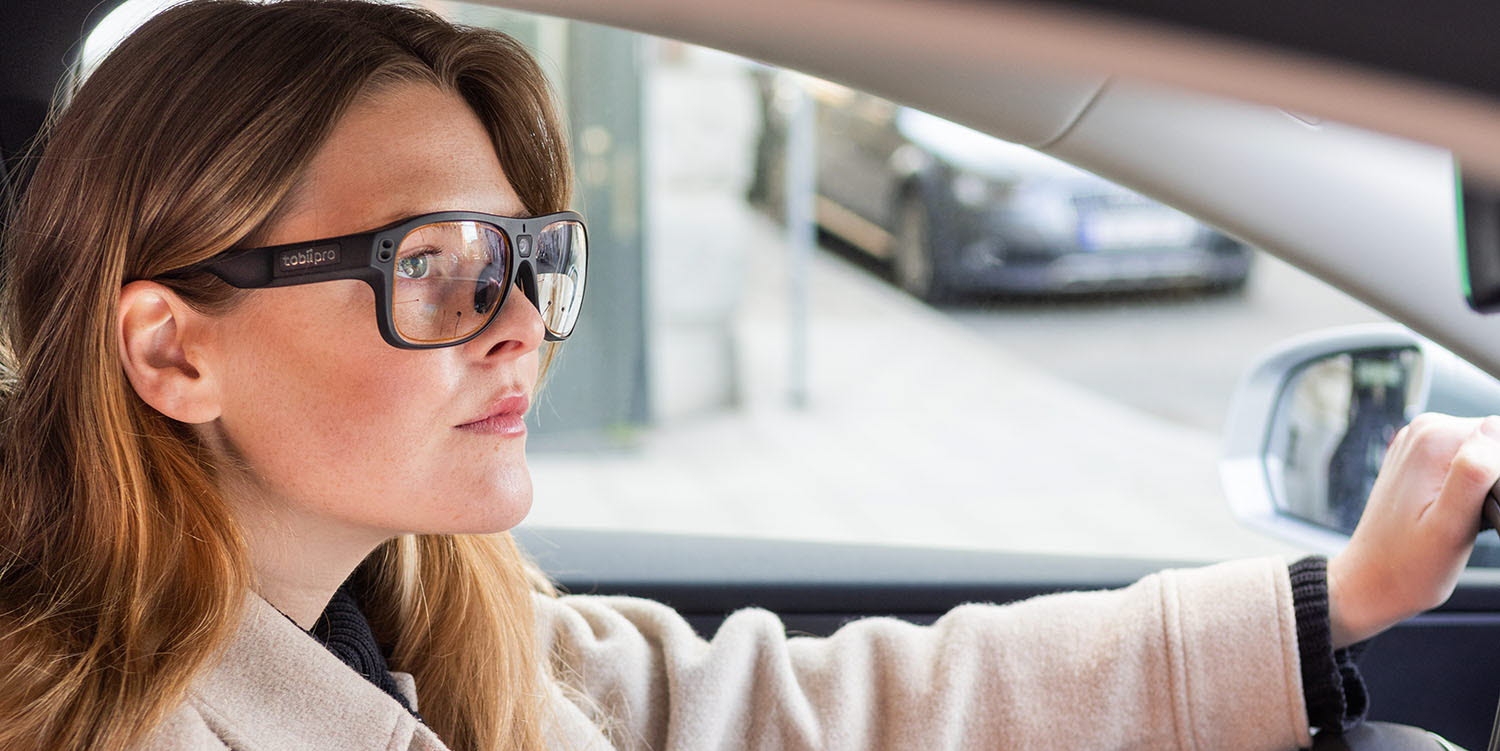 Woman driving a car with Tobii Pro Glasses 3