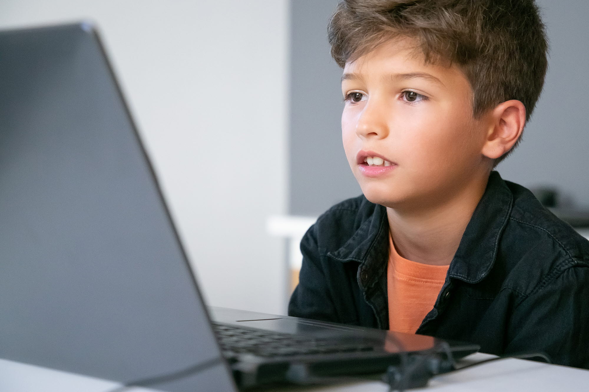 Boy in front of a laptop